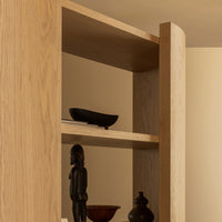 Natural oak wood grain with smooth, rounded edges; minimalistic design featuring dark decorative accents.