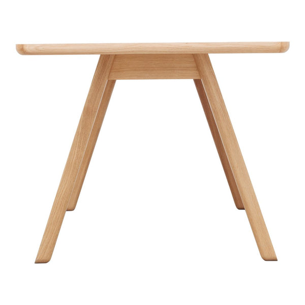 Natural wood finish table with a smooth surface and minimalist design, featuring light oak color and clean lines.