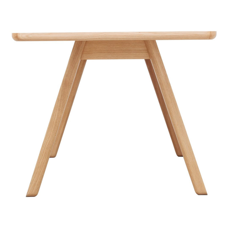 Natural wood finish table with a smooth surface and minimalist design, featuring light oak color and clean lines.