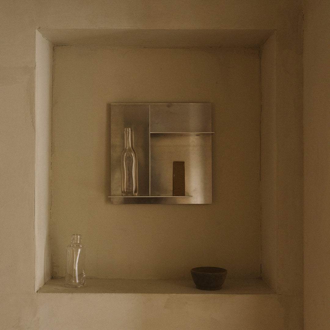 Minimalist wall shelf in soft beige tones with clear glass and a dark brown accent. Simple and elegant design.