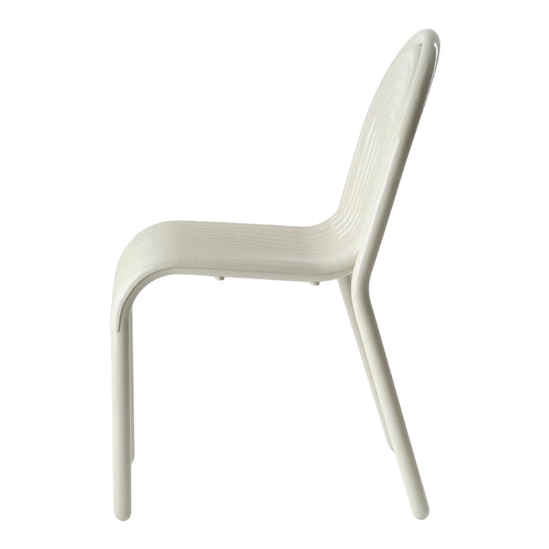 White chair with smooth, curved lines and subtle ribbed texture, perfect for modern decor.