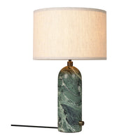 Green marbled base with a textured beige lampshade. Elegant design adds a touch of sophistication to any room.