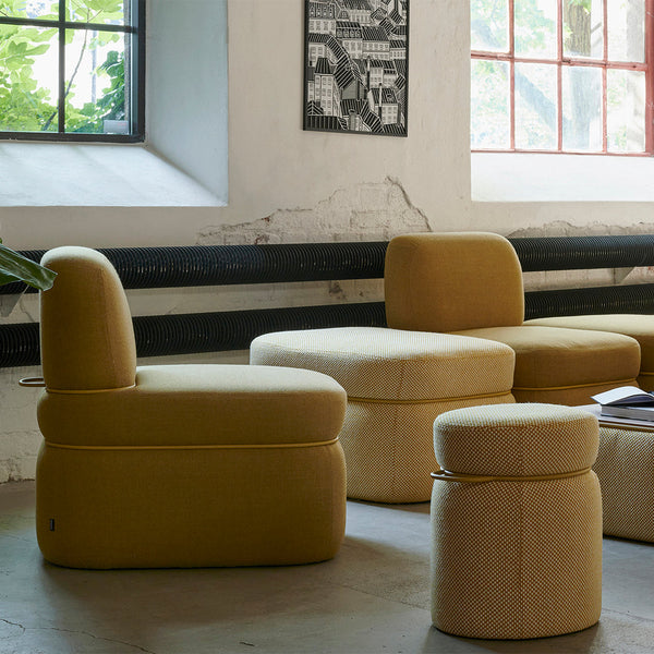 Yellow upholstered seating with textured patterns in various shapes, creating a modern, stylish look for home decor.
