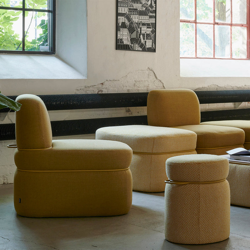 Yellow upholstered seating with textured patterns in various shapes, creating a modern, stylish look for home decor.