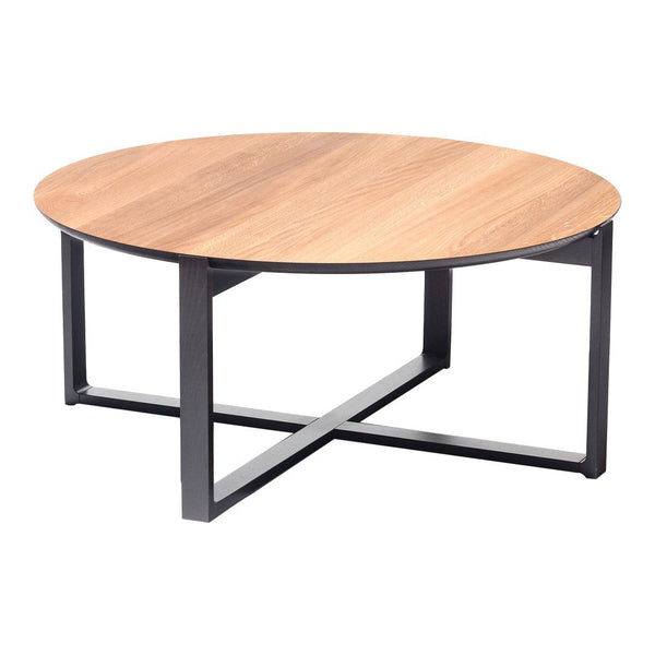 Round coffee table with a light wood grain top and sleek black metal base. Modern, minimalistic design.