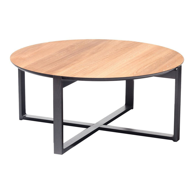 Round coffee table with a light wood grain top and sleek black metal base. Modern, minimalistic design.