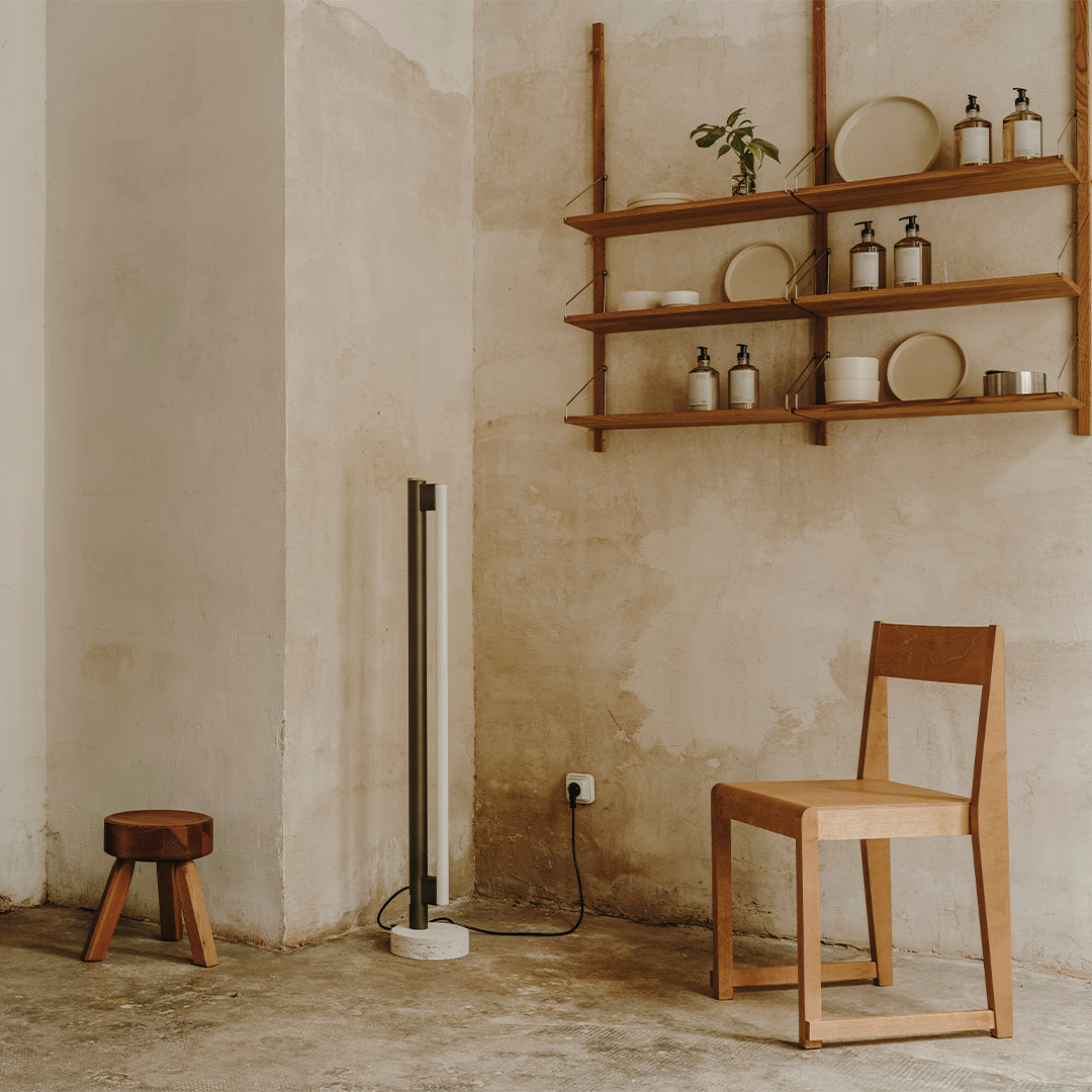 Natural wood tones, neutral beige walls, and minimalist decor create a warm, inviting atmosphere.