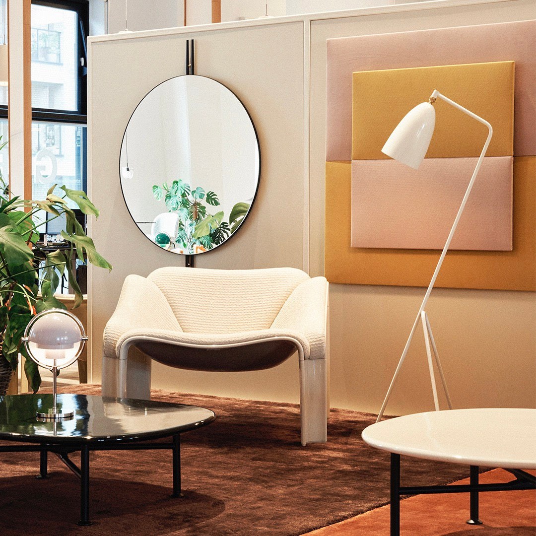 Modern living room with neutral tones, soft beige patterns, and geometric shapes in decor. Elegant color palette and textures.