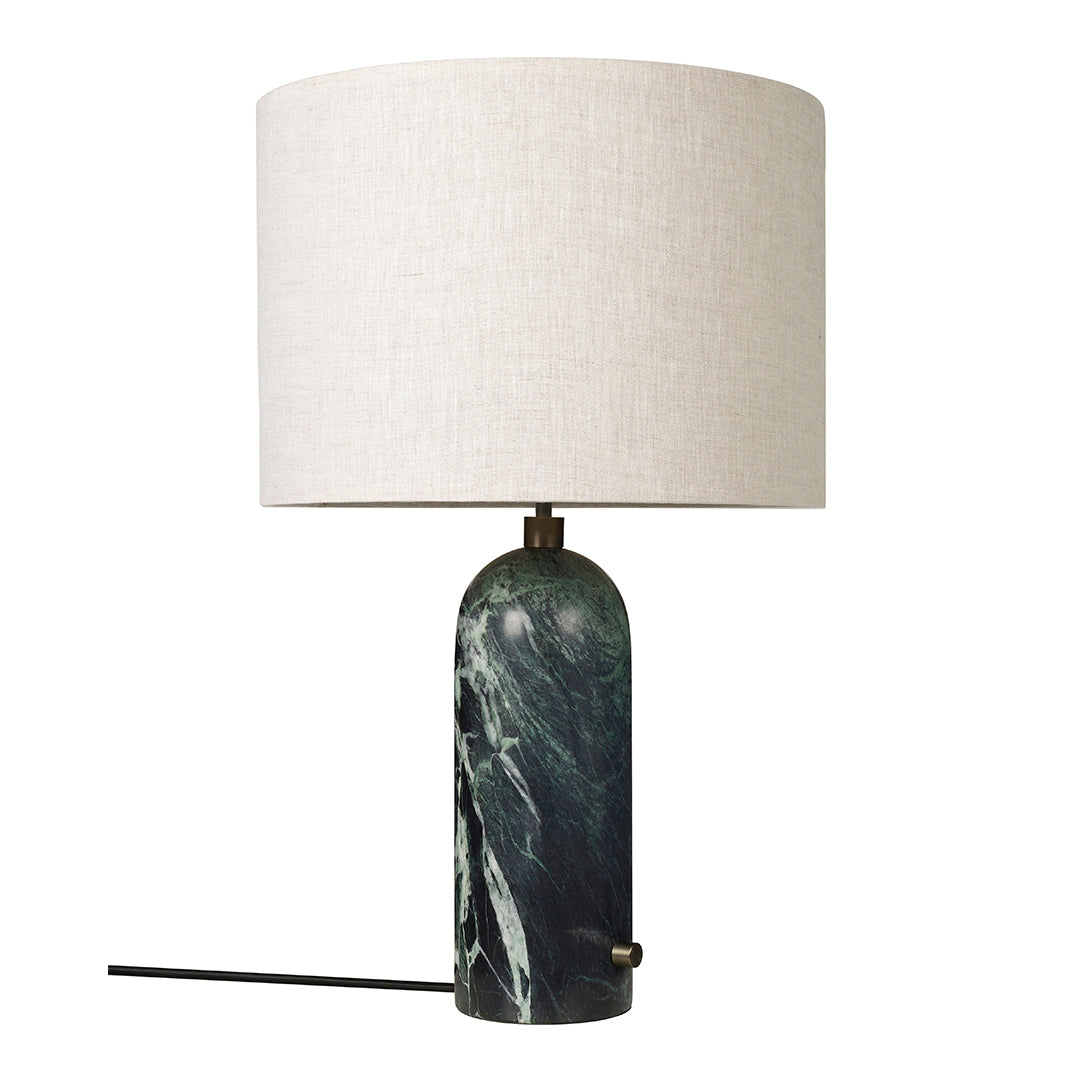 Stylish lamp featuring a dark green marble base and a neutral linen shade, perfect for modern decor.