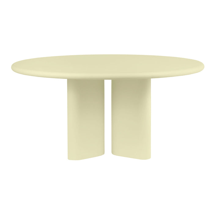 "Round table in soft cream color with a smooth finish and minimalist design."