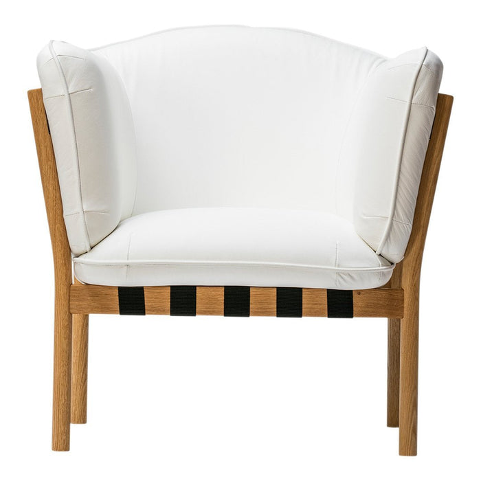 White upholstered chair with a natural wood frame and black horizontal stripes on the base.