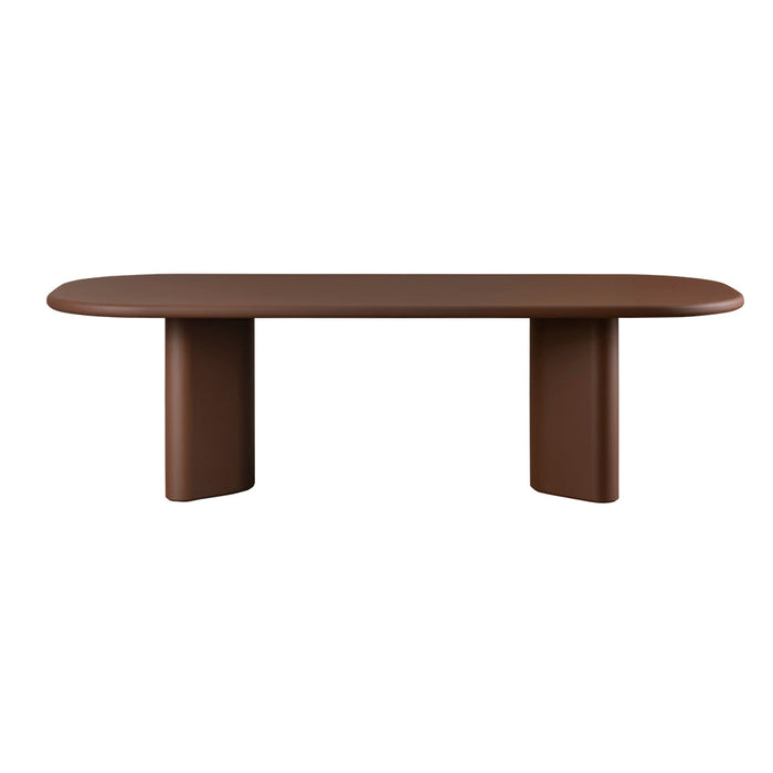 Brown oval table with a smooth finish, featuring a contemporary design and minimalist style.