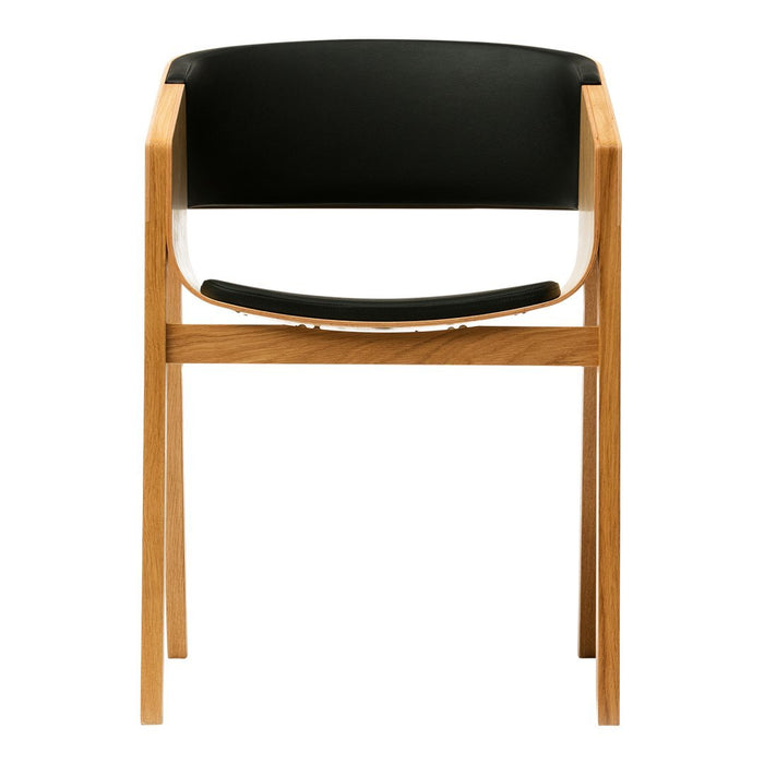 Black and natural wood armchair with a sleek, modern design and minimalistic aesthetic.