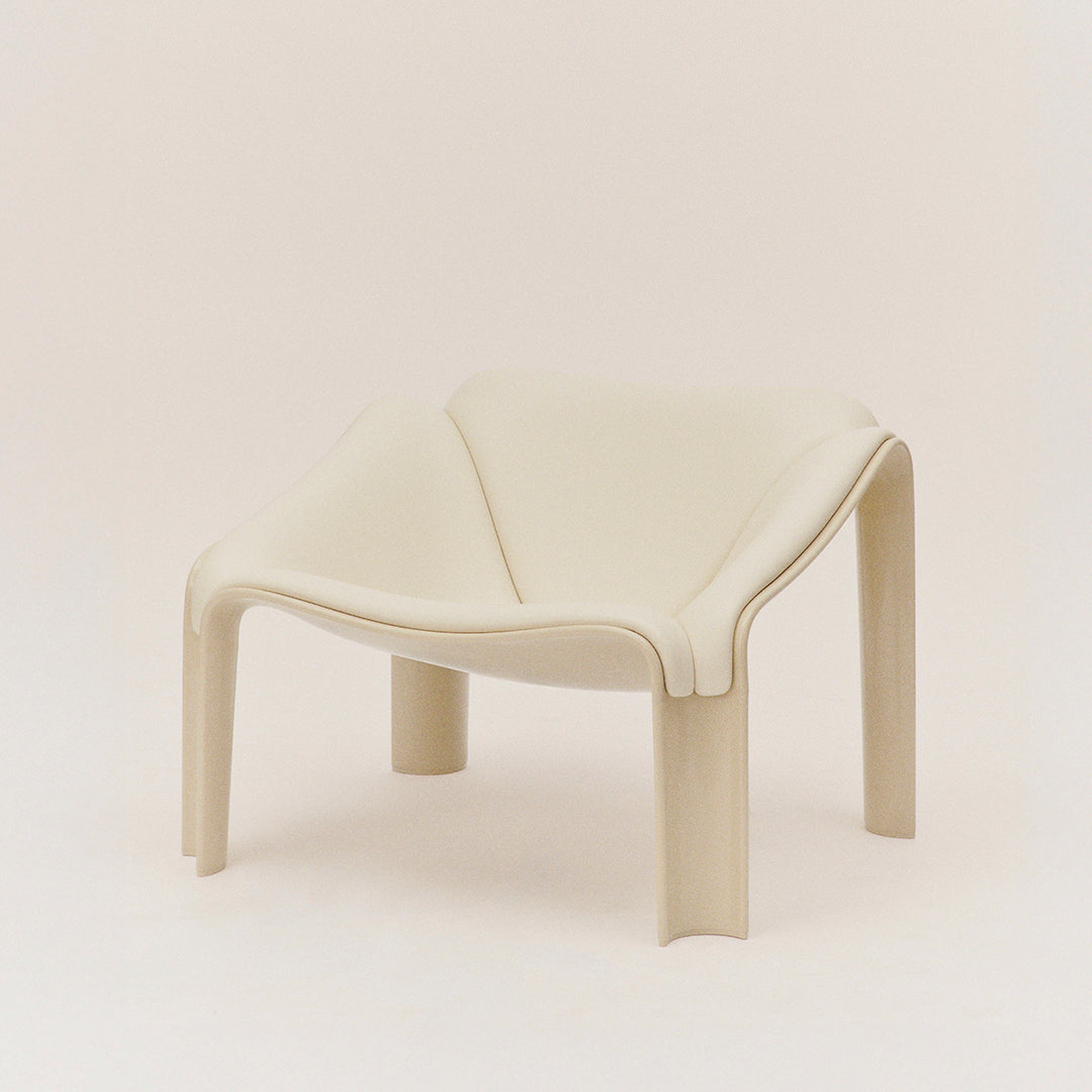 Neutral beige chair with a modern, minimalist design and smooth, curved lines. Ideal for contemporary interiors.