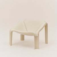 Neutral beige chair with a modern, minimalist design and smooth, curved lines. Ideal for contemporary interiors.