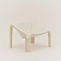 Beige modern chair with smooth curves and minimalistic design, featuring a clean, solid pattern.