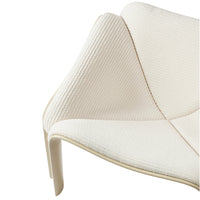 Textured cream fabric armchair with subtle ridges and curves, perfect for modern decor.