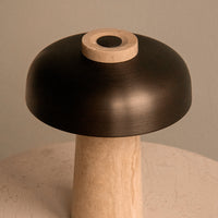Black and cream color contrast lamp with smooth, rounded shapes and a minimalist design. Perfect for modern decor.