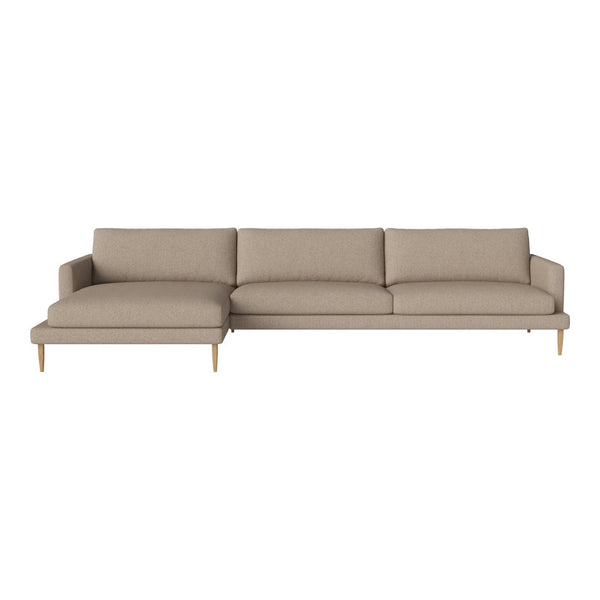 Beige upholstered sectional sofa with a simple, modern design and light wooden legs. Perfect for any living space.
