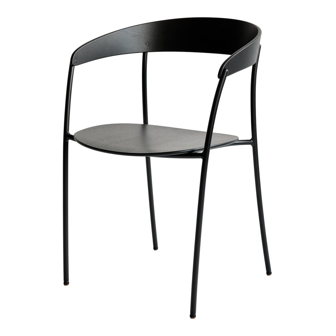 Black minimalist chair with a sleek design and curved backrest, featuring a smooth matte finish and slender legs.