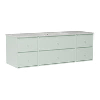 Light mint green storage cabinet with six drawers and a smooth white countertop. Modern, minimalist design.