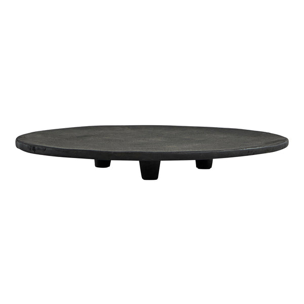 Black round serving platter with a smooth finish and three short legs, perfect for modern table settings.