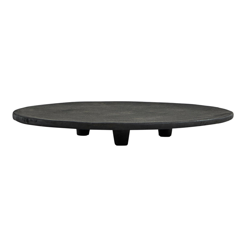 Black round serving platter with a smooth finish and three short legs, perfect for modern table settings.