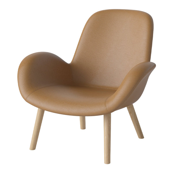 Tan leather accent chair with smooth texture and light wood legs, blending modern style with warmth.