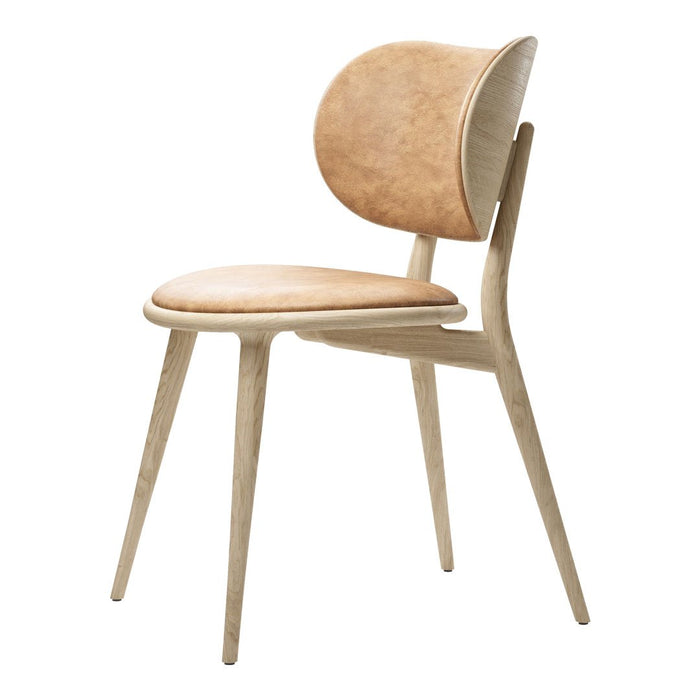 Natural wood chair featuring a light beige leather seat and curved back, combining modern design with soft tones.
