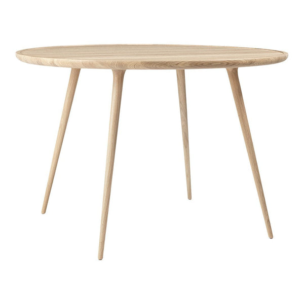 Light wood round table with tapered legs, featuring a natural finish and smooth surface. Perfect for modern interiors.