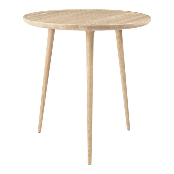 Light oak round side table with smooth, natural wood grain and tapered legs. Minimalist design perfect for modern decor.