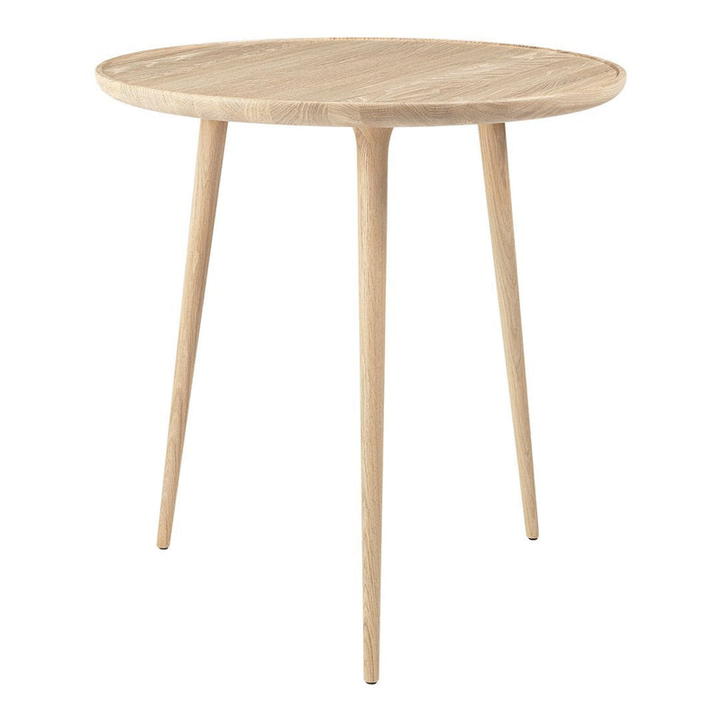 Light oak round side table with smooth, natural wood grain and tapered legs. Minimalist design perfect for modern decor.