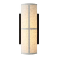 Beige and white fabric wall sconce with a modern grid pattern and black accents. Perfect for contemporary decor.