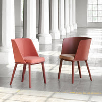 Stylish chairs with a coral pink and beige color scheme, featuring sleek, modern designs and smooth finishes.