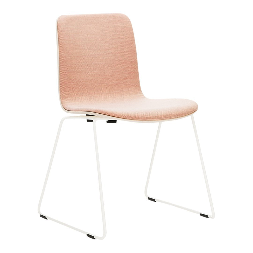 Blush pink chair with a smooth finish and white metal legs, perfect for modern decor.