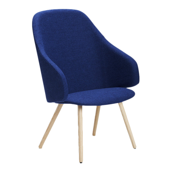 Cozy navy blue upholstered chair with smooth contours and natural wood legs, perfect for modern decor.