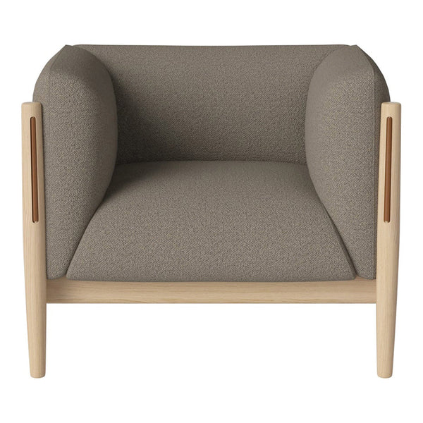 Gray upholstered armchair with rounded arms and natural wood accents. Minimalist design with a neutral color palette.