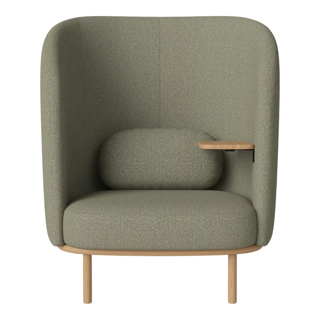Green upholstered armchair with a rounded design and wooden legs, featuring a matching lumbar support cushion.