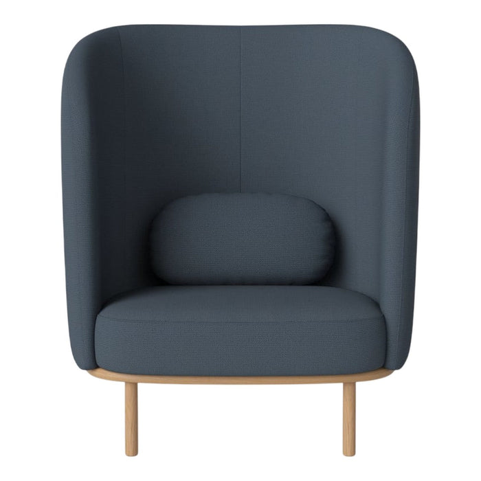 Cozy dark blue upholstered armchair with a rounded back and wooden legs, featuring a matching lumbar pillow.