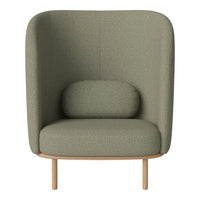 "Cozy green upholstered chair with a smooth texture and rounded backrest, featuring a minimalist wooden base."