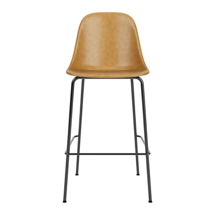 Tall bar stool with a sleek caramel-colored seat and contrasting black metal frame. Stylish and modern design.