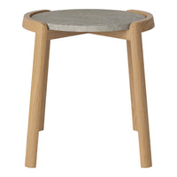 Natural wood table with a sleek gray concrete top and minimalist design, featuring light wood legs and curved edges.
