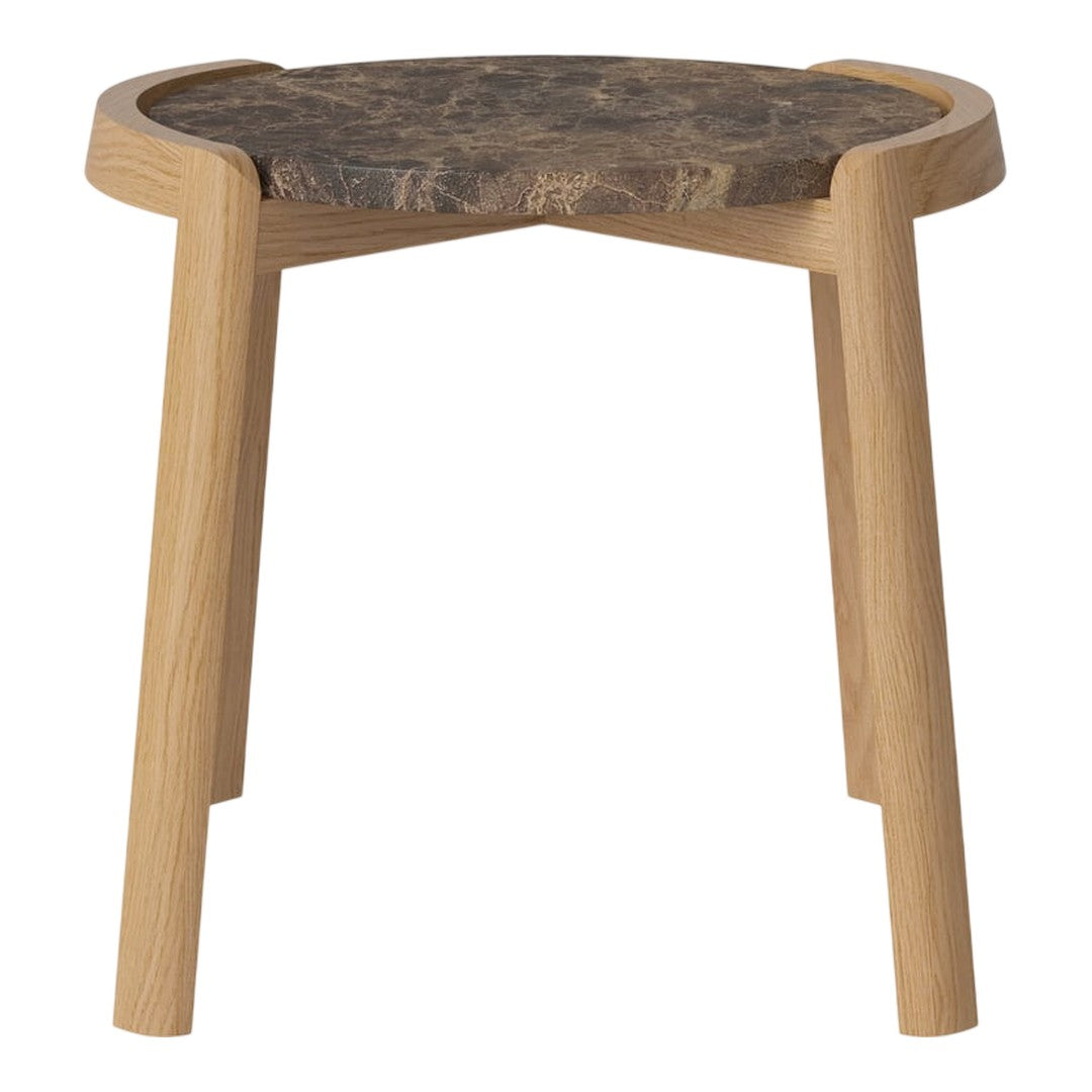 Natural wood legs support a round, dark patterned tabletop for a modern, earthy aesthetic. Perfect for any space.