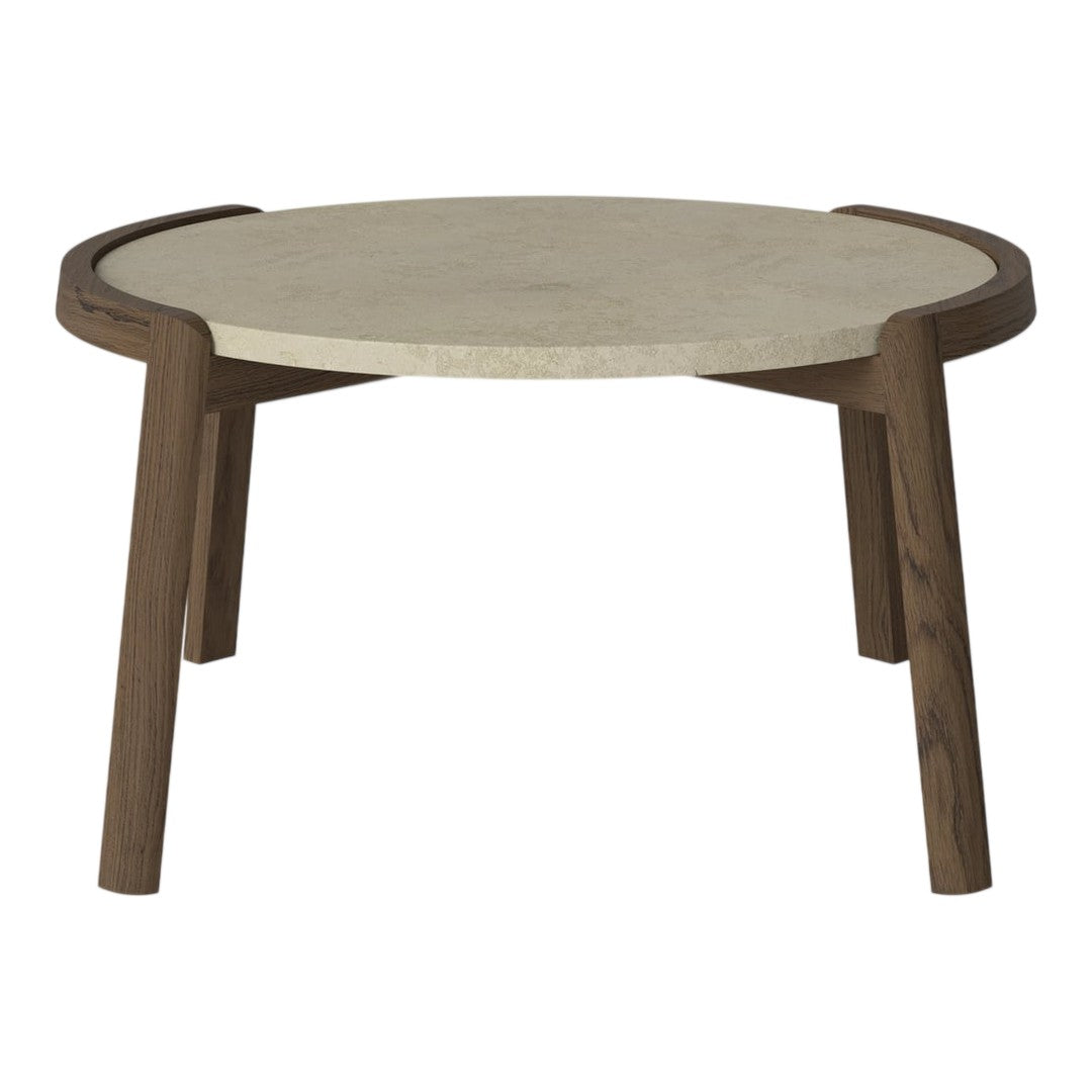 Round coffee table with a light stone top and dark wood legs, featuring a sleek, modern design and subtle curves.