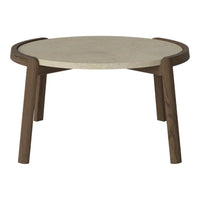 Round coffee table with a light stone top and dark wood legs, featuring a sleek, modern design and subtle curves.