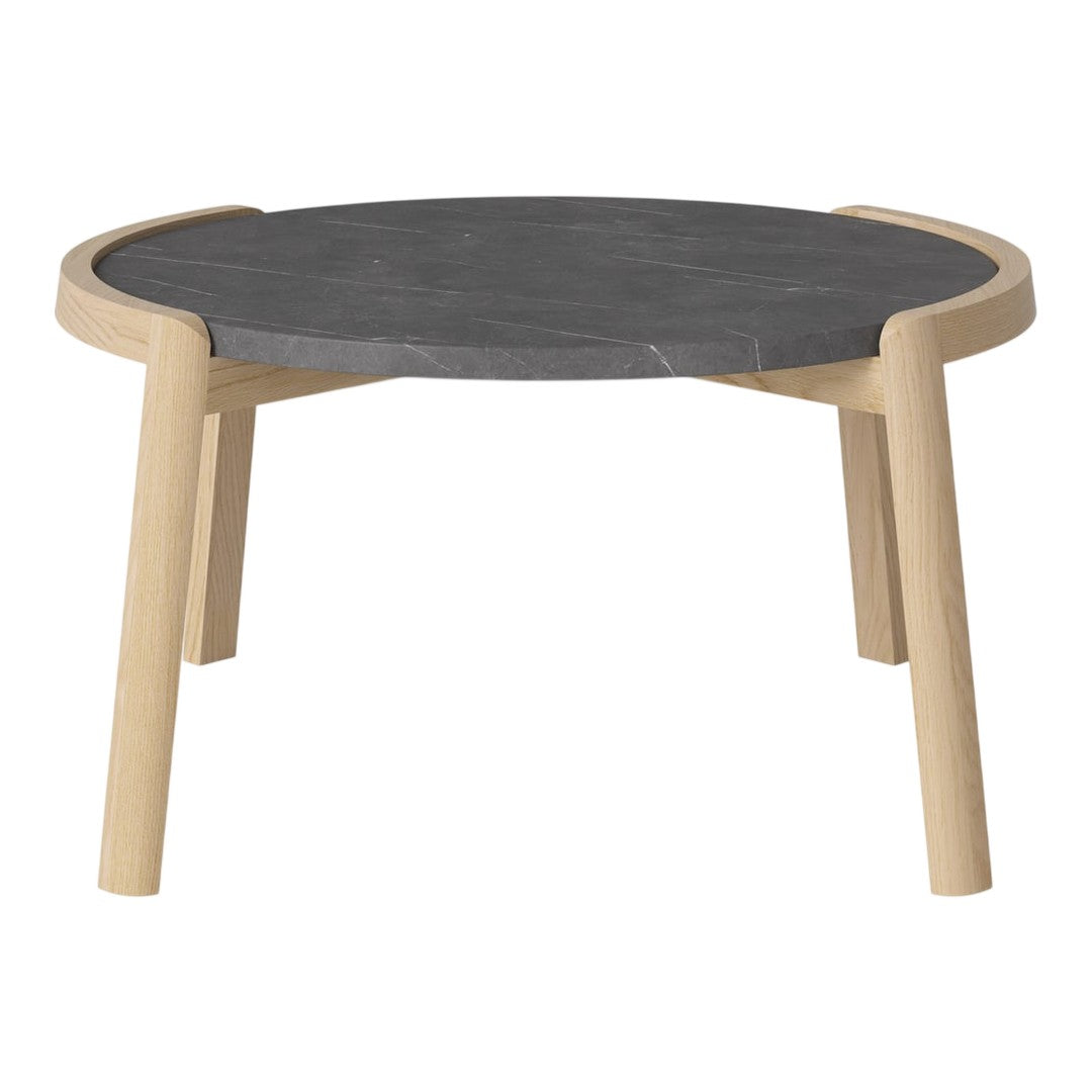Round black marble top coffee table with natural wood legs, featuring a minimalist design and neutral color palette.