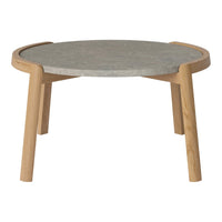Round coffee table with a gray stone top and natural wood legs, featuring a smooth finish and minimalist design.