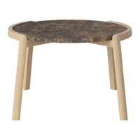 Round table with a dark patterned top and light wooden legs, perfect for modern decor.