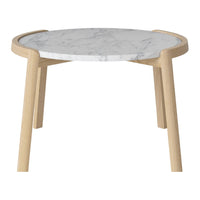 Round table with a white marble top and natural wood legs, featuring a sleek and minimalist design.