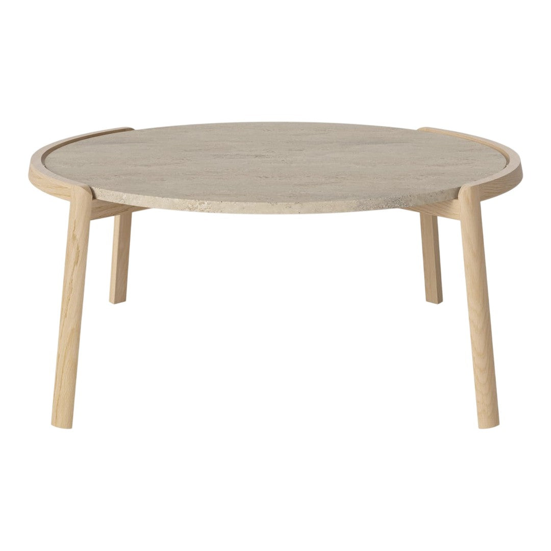 Light wood round coffee table with a smooth grain finish and natural beige tones.